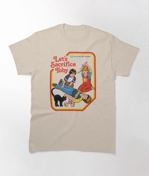 The Sacrifice Toby T-shirt Natural MED by Blue Dog Posters features a vintage-style design showing three children and a black cat. Engaged in a playful yet sinister activity, the text reads "Let's Sacrifice Toby" and "Activities for Children." This super cool beige T-shirt is available in multiple sizes.