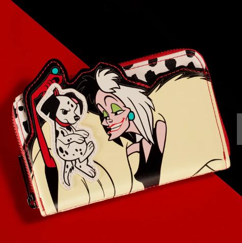Part of the exclusive Disney collection, the Blue Dog Posters 101 Dalmations Cruella Zip Purse features an iconic illustration from "101 Dalmatians." Showcasing Cruella holding a Dalmatian puppy, the wallet sports a striking red, black, and white theme with an inner lining of Dalmatian spots.