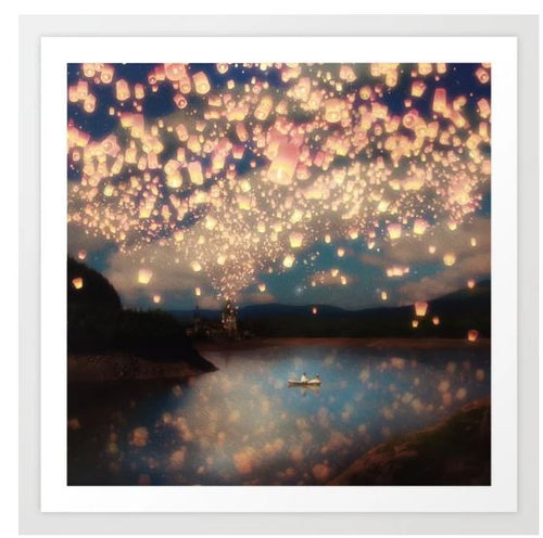 A serene nighttime scene with thousands of glowing lanterns floating into the sky, reflecting off a calm lake. A small boat with two occupants is visible on the water, surrounded by softly illuminated hills and a castle in the background. This stunning view is captured in our "Love Wish Lanterns" art print by P Belle Flores, available from Blue Dog Posters.