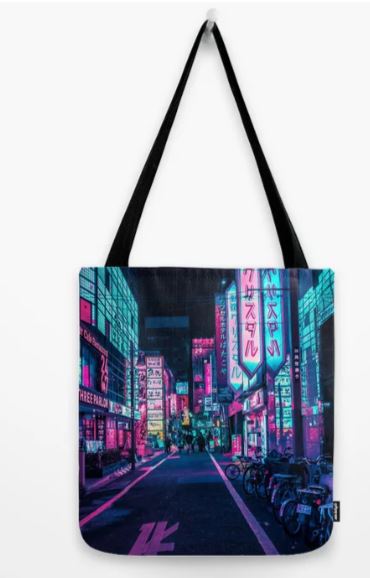 The "Tote Bag 40x40cm Neon Wonderland" from Blue Dog Posters' Giftware Collection, featuring black handles, hangs on a hook. The bag's design showcases a neon-lit street inspired by a cyberpunk aesthetic, adorned with vibrant Japanese character signs and motorcycles lined up on the right. Crafted from high-quality blended fabric, it ensures both durability and style.