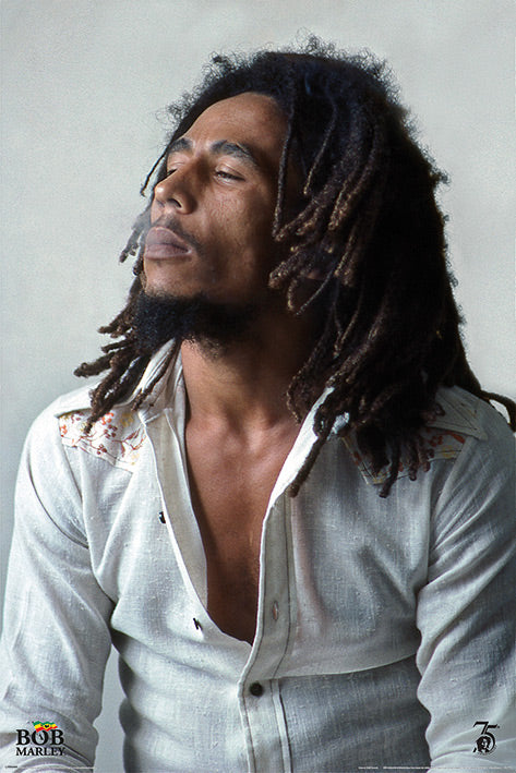 A man with dreadlocks and a beard sits with his eyes closed, exhaling smoke, on a Music Poster. He is wearing a semi-open white shirt. The bottom corners of the image feature text and logos, including a small circular emblem with the number 75 on Bob Marley Redemption by MUS 178.