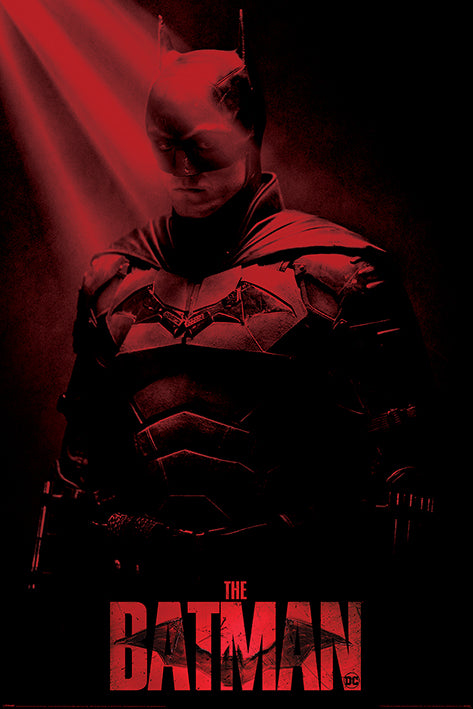 Presenting "The Batman Crepuscular Rays" poster from MTV 055. This stunning artwork features Batman, depicted in a dark red hue, standing waist-up under a dramatic spotlight with a downward gaze. He is wearing his iconic bat suit and mask. Printed on premium 150gsm gloss paper, the words "THE BATMAN" are prominently displayed at the bottom.