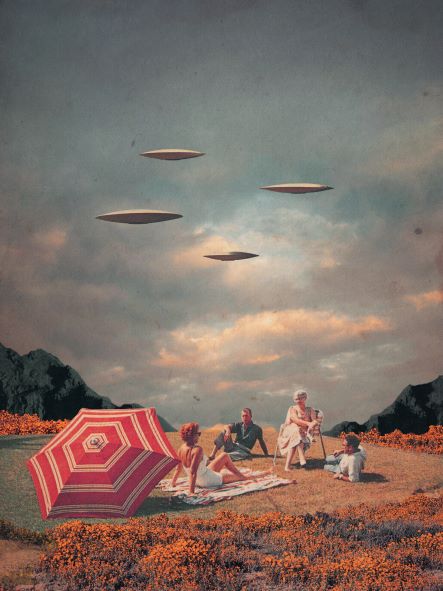 A surreal scene titled "Pretend They Never Came" by Frank Moth, featuring four people and a dog relaxing on a grassy field under a red and white striped umbrella and blanket. Three unidentified flying objects hover in the cloudy sky above. In the background, dark mountains rise above a field of orange flowers. This Art Print captures Frank Moth's signature style and is offered by Blue Dog Posters.