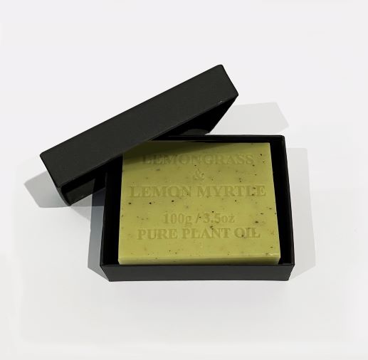 A square bar of light green soap with natural extracts, embossed with the text "Hustle and Co Soap - Fuck This Shit 100g/3.5oz PURE PLANT OIL," in an open black box with the lid resting beside it, set against a plain white background. Brand: Blue Dog Posters.
