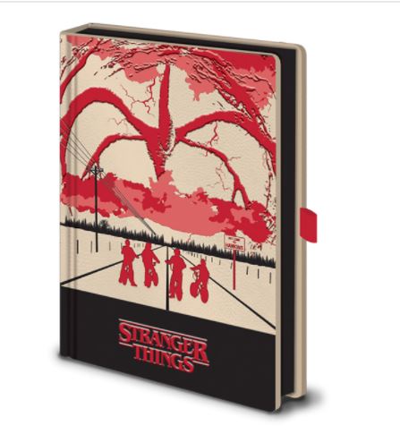 Introducing the Stranger Things Light Up A5 Prem Notebk by Blue Dog Posters, a premium notebook with a cover illustration inspired by the hit series, Stranger Things. The cover beautifully depicts silhouettes of four children riding their bicycles against an ominous red sky, highlighting a monstrous creature with tentacle-like arms. The title "Stranger Things" is prominently printed at the bottom, making this notebook an ideal stationery gift for fans of the show.
