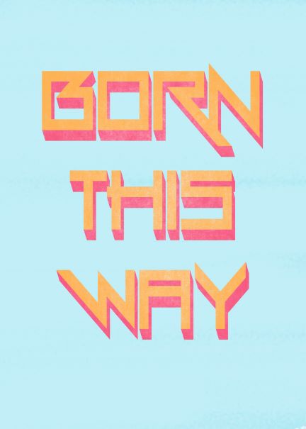 The Typography A5 - Born This Way print from Blue Dog Posters showcases the phrase "BORN THIS WAY" in bold, angular, orange letters with a pink shadow effect, set against a pale blue background. This vibrant design is perfect for displaying in deluxe postcard frames or as mini prints to add a pop of color to any space.