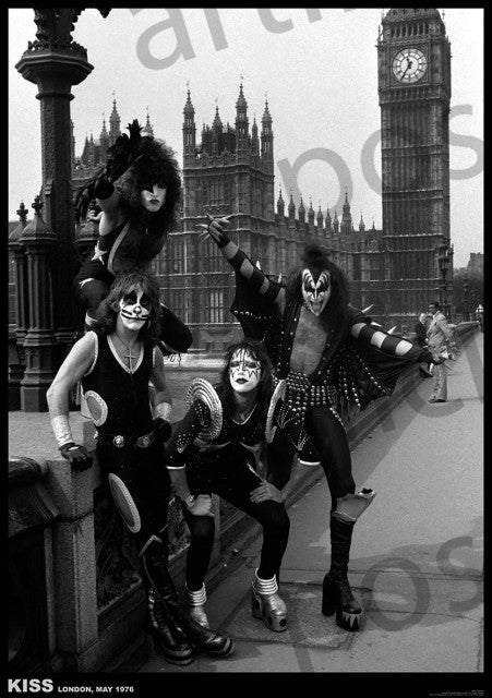 A black and white photo of the rock band KISS in full makeup and costumes, posing on Westminster Bridge with the Houses of Parliament and Big Ben visible in the background. Captioned "KISS London, May 1976," this **MUS 262 Kiss - London May 1976** poster is perfect for any music collection and printed on premium 150gsm gloss paper.