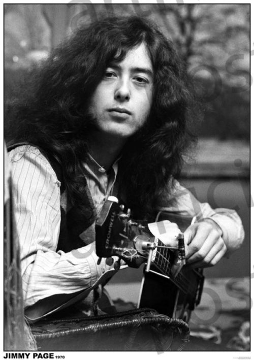 A black and white photo captures a young Jimmy Page with long, wavy hair sitting with an acoustic guitar. He is wearing a button-up shirt under a vest and has a contemplative expression. The text at the bottom reads "JIMMY PAGE 1970." Ideal for any music collection, this poster from MUS 327 is printed on premium 150gsm gloss paper.