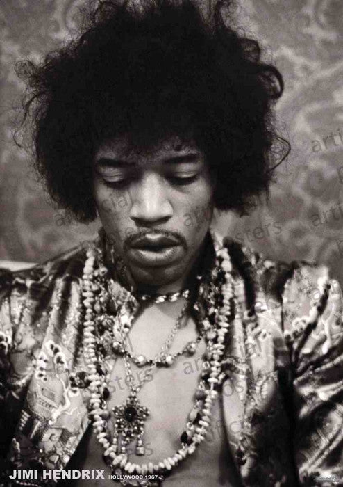 A man with curly hair and beaded necklaces, dressed in patterns, stands before a patterned background. This MUS rock poster reads "Jimmy Hendrix Hollywood 1967" at the bottom.