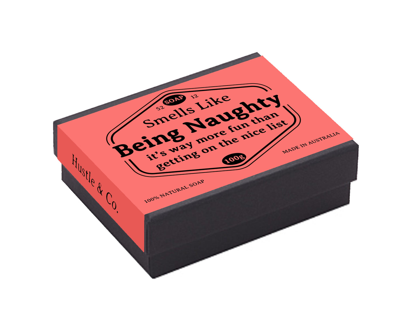 A rectangular black box with a pink label on top reads "Smells Like Being Naughty. It's way more fun than getting on the nice list. 100g, Hustle and Co Soap - Being Naughty, Blue Dog Posters, Made in Australia." This Australian-made soap is crafted with natural goat’s milk. Text on the side reads "Blue Dog Posters.