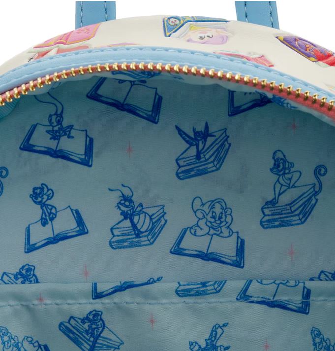 The interior of the Disney Princess Books Mini Backpack by Blue Dog Posters is lined with a light blue fabric showcasing blue illustrations of beloved Disney characters like Tinker Bell, Jaq and Gus, and Genie, all engaging with books. The open zipper reveals part of the bag's exterior, capturing the enchanting essence of Classic Tales and Disney Princess adventures.