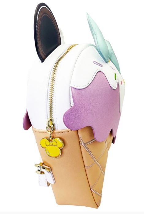 Introducing the Disney Minnie Ice Cream Backpack from Blue Dog Posters, a delightful Loungefly backpack designed to resemble an ice cream cone with adorable cat ears. The tan cone features a charming waffle pattern, while the main body of the bag is white with pastel pink accents mimicking creamy ice cream. A gold zipper is accented with a yellow mouse-shaped keychain, paying homage to Disney's Minnie Mouse.