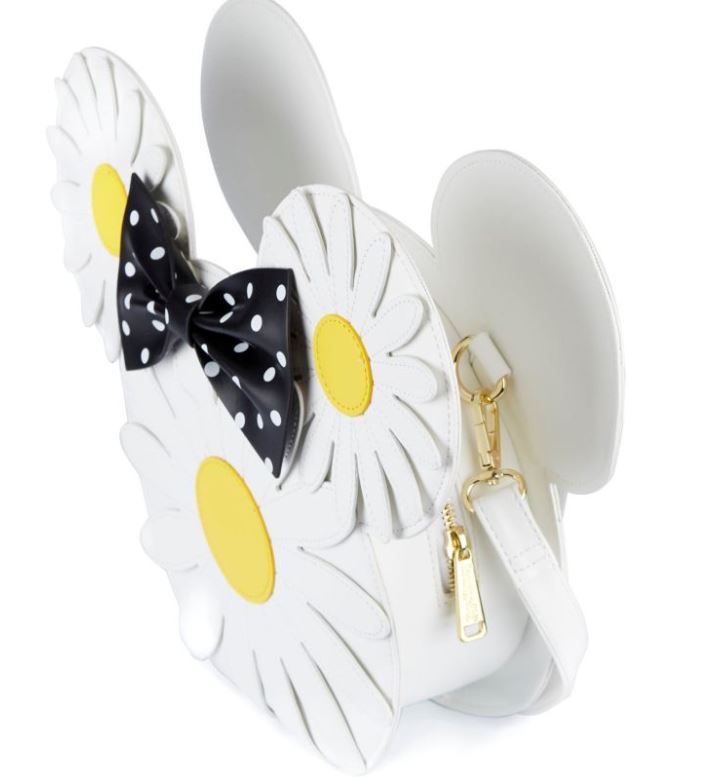 The Disney Minnie Mouse Daisies Crossbody Bag by Blue Dog Posters is a charming crossbody bag featuring adorable mouse ears, two white daisies with yellow centers, a black bow with white polka dots, a white shoulder strap, and a gold zipper pull. Made from vegan leather, this bag is both stylish and cruelty-free.