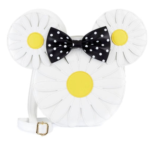 Introducing the Disney Minnie Mouse Daisies Crossbody Bag by Blue Dog Posters: This white, circular handbag is designed to resemble a daisy with yellow centers. It features two smaller circles on top that look like ears, and a black bow with white polka dots in the center. Made from high-quality vegan leather, it comes with a white strap that has a gold buckle. This stylish accessory is officially licensed by Disney.