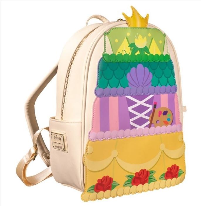 The Disney Princess Layer Cake Mini Backpack from Blue Dog Posters is a cream-colored Loungefly mini backpack adorned with whimsical, colorful designs inspired by various Disney princess themes. The front showcases tiered illustrations of floral patterns, a crown, and numerous decorative elements.