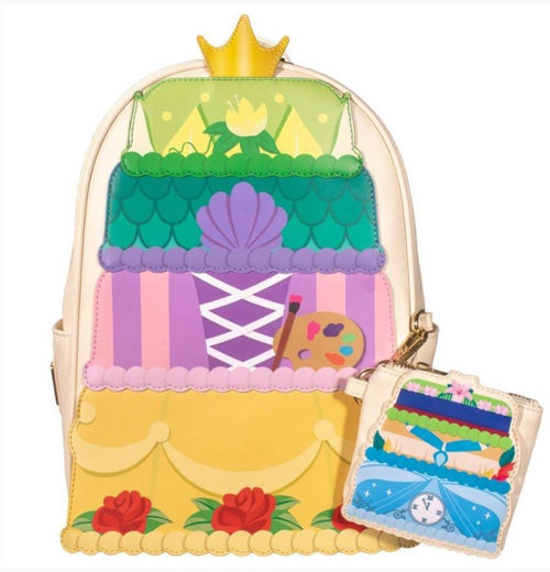 Introducing the Disney Princess Layer Cake Mini Backpack by Blue Dog Posters, a vibrant and intricately designed accessory that resembles a tiered cake. It features a golden crown on top and patterns inspired by beloved Disney Princess themes. The backpack also comes with an attached, matching coin pouch decorated with a clock and blue carriage motif.