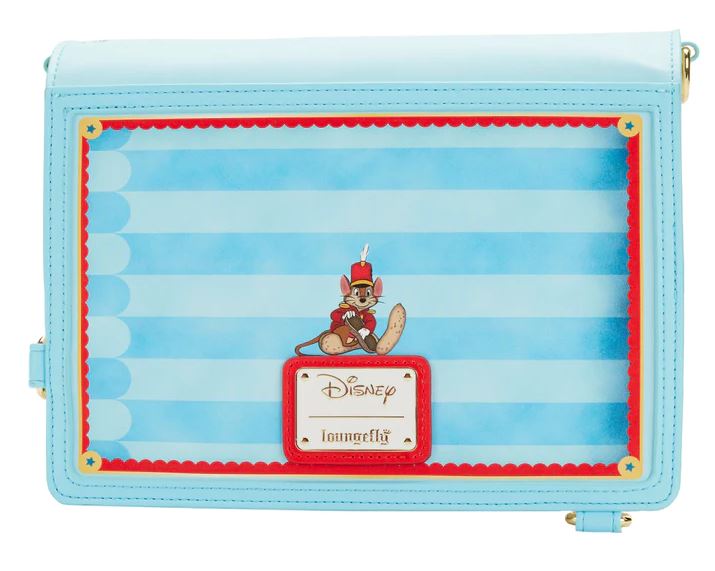 This Dumbo 1941 Book Convertible Crossbody from Blue Dog Posters is a light blue vegan leather crossbody bag showcasing a striped design with an adorable illustration of Timothy Q. Mouse from Disney's "Dumbo" at the center. Highlighted by a red frame around the illustration, it prominently features the "Disney Loungefly" logo at the bottom.