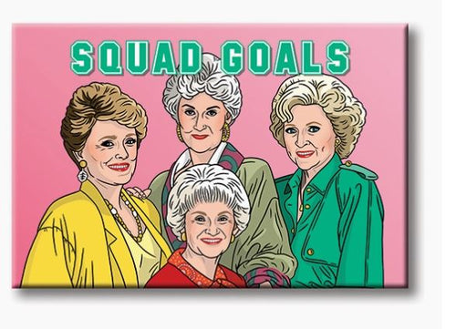 The Golden Girls Squad Goals Magnet by Blue Dog Posters features a vibrant illustration of four women standing together against a pink background, resembling playful house guests. Above them, the text "SQUAD GOALS" is prominently displayed. Dressed in colorful outfits—yellow, red, green, and light green—the women appear happy and confident, showcasing unity and friendship.