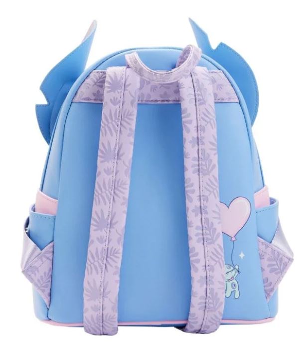 The Lilo & Stitch Heart Stitch Mini Backpack by Blue Dog Posters is a small, light blue backpack made from vegan leather, featuring pastel purple accents and straps with a floral pattern. It includes wing-like protrusions at the top, side pockets, and a heart graphic with a small character holding a balloon near the bottom corner.