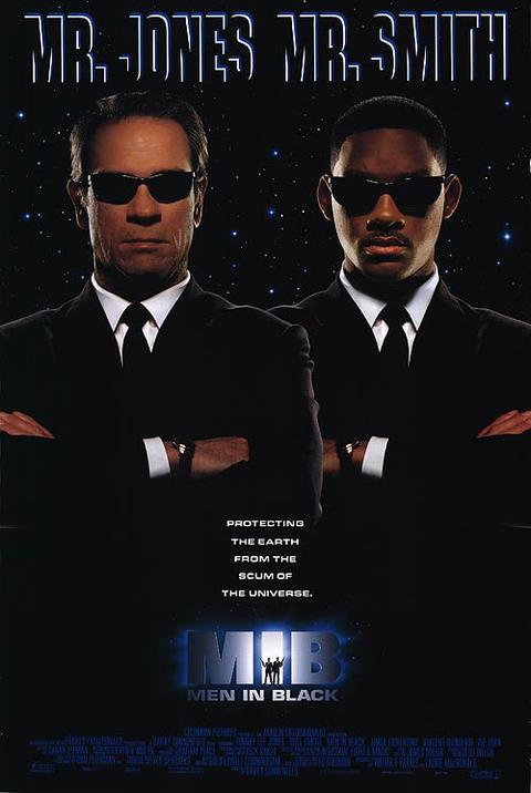 Movie poster for "Men in Black" featuring two men in black suits with sunglasses. They stand with arms crossed against a starry background. Text at the top reads "Mr. Jones Mr. Smith" and at the bottom, "Protecting the Earth from the scum of the universe." Available as an IMP 068 extra-large import poster printed on premium 150gsm gloss paper.