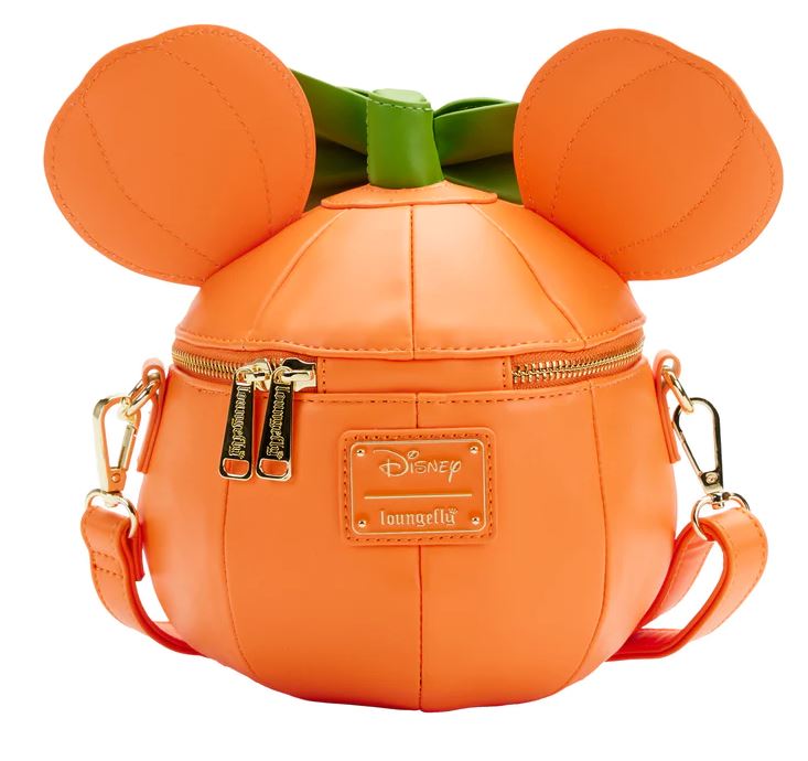 The Disney Minnie Pumpkin Face Crossbody Bag by Blue Dog Posters is an orange-colored Halloween accessory designed to resemble a pumpkin, featuring mouse ears and a green stem handle on top. It has gold-tone zipper closures and a crossbody strap. The front includes a Glow Face Minnie Pumpkin Disney x Loungefly branded plaque.