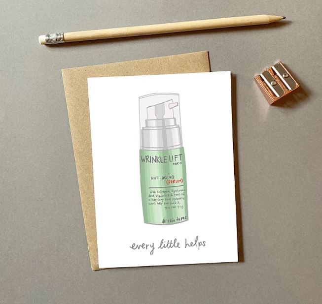 The Wrinkle Cream Greeting Card from Blue Dog Posters showcases an illustration of a "Wrinkle Lift" anti-aging serum bottle. The blank card is paired with a brown envelope, and for an added touch of charm, it's complemented by a wooden pencil and metal sharpener. The text reads, "every little helps.