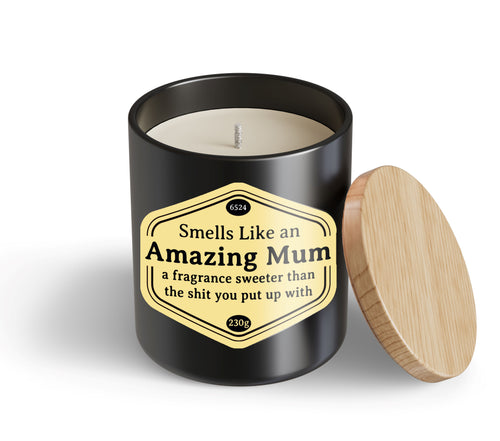 The Amazing Mum Candle Hustle & Co by Blue Dog Posters features a black jar with a wooden lid and a label: "Smells Like an Amazing Mum – a fragrance sweeter than the shit you put up with.