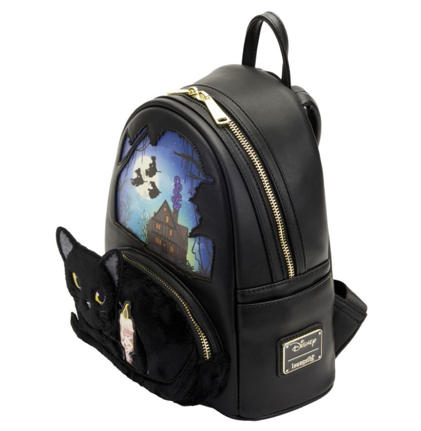 The Hocus Pocus Binx Plush Pocket Mini Backpack by Blue Dog Posters is a black backpack showcasing a spooky haunted house scene complete with bats and a full moon on the upper section. The lower pocket features a plush Thackery Binx black cat face design with yellow eyes, complemented by gold zippers and adorned with Disney and Loungefly logo tags on the front.