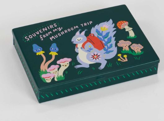 The Blue Dog Posters "Souvenirs From my Mushroom Trip Small Tin" features a dark green design with a playful squirrel in a red backpack amid colorful mushrooms, flowers, and pebbles. The lid says, “SOUVENIRS FROM MY MUSHROOM TRIP.”.