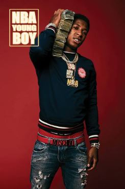 A young man poses with a large cash stack to his ear against a red backdrop, wearing gold chains and ripped jeans. "NBA Youngboy Cash Stack" by MUS 373 is perfect for rap fans and music collections, with "NBA YOUNG BOY" in the corner.