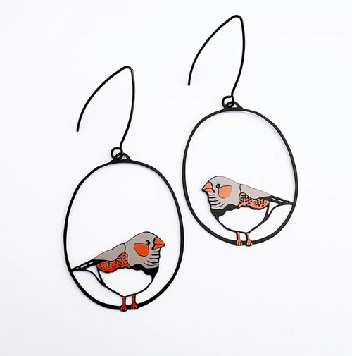 Add a playful touch to your style with Midi Zebra Finch Earrings by Denz from Blue Dog Posters. These hypoallergenic wire hoops feature colorful zebra finch designs with gray bodies, orange beaks, and dotted wings on a white background.