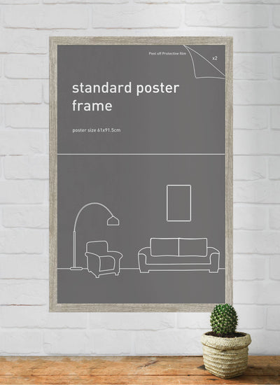 A framed gray poster featuring a minimalist line drawing of a sofa, armchair, lamp, and picture frame. Leaning against a white brick wall on a wooden surface next to a small potted cactus, it showcases the "Classic Frame 61x91.5cm Ash" by Blue Dog Posters for timeless elegance.