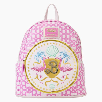 The Barbie The Movie Logo Mini Backpack by Blue Dog Posters features a charming pink and white pattern with a front pocket adorned with two pink flamingos, palm trees, seashells, and starfish in a delightful tropical motif. A large "B" prominently displays the classic Barbie logo. This stylish backpack is finished with a top handle and gold-tone hardware accents.