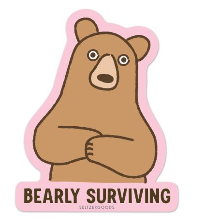 A worried cartoon bear crosses its arms above bold "BEARLY SURVIVING" text. This water-resistant Bearly Surviving Vinyl Single Sticker by Blue Dog Posters has a pink border—perfect for your laptop.