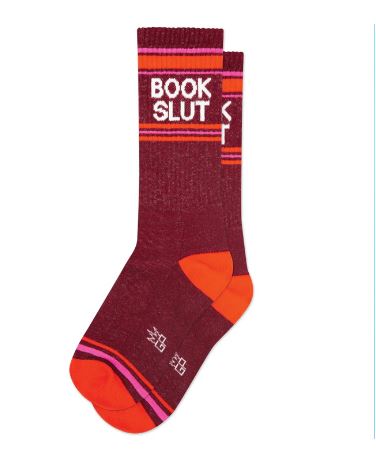 Blue Dog Posters' Book Slut Gym Crew Socks are maroon unisex socks with orange toes and heels, pink and orange stripes, and "BOOK SLUT" in white—comfy and perfect for book lovers.