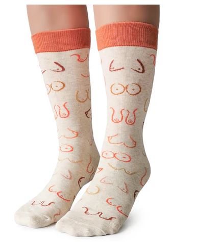 Simply the Breast Socks by Blue Dog Posters are beige women’s socks made from combed cotton, featuring orange cuffs and a playful cartoon-style breast pattern in pink, red, and brown for quirky everyday comfort.