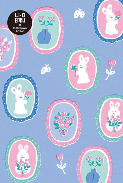 The Bunnies and Flowers Riso Postcard by Blue Dog Posters showcases white bunnies holding flowers within pink, green, and blue oval frames on a blue backdrop, surrounded by colorful floral arrangements with scattered butterflies and tulips.
