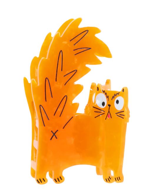 A bright orange, cartoon-style cat figurine with a bushy tail and wide eyes stands on four legs—resembling the playful mascot for Blue Dog Posters’ Azz Hole Angry Cat Hair Claw—set against a white background.