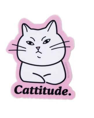 The Catitude Vinyl Single Sticker by Blue Dog Posters features a cartoon white cat with a sassy expression, black outline, pink border, and "Cattitude." in bold letters. Matte finish. Made in the USA.