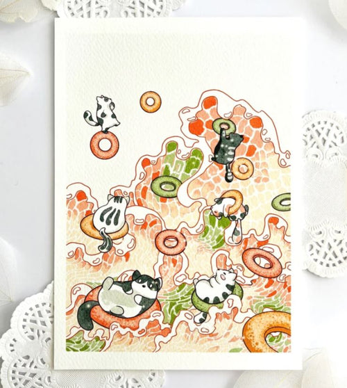 The "Cats and Fruit Loops" poster by Plain Rice Studios, from Blue Dog Posters, features playful digital art of cats lounging and diving among vibrant fruit loops on an abstract orange and green background in a colorful watercolor style.