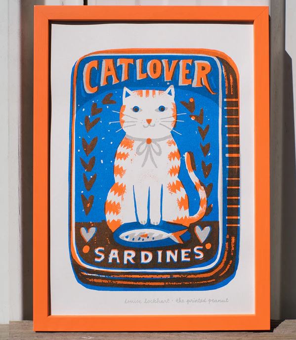 The Cat Lover A4 Print by Printed Peanut from Blue Dog Posters features an illustrated orange and white cat with a fish and hearts, and the words "Cat Lover Sardines"—a perfect wall decor for any feline fan.
