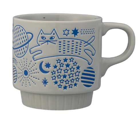 The Cat Flower Garden Stone & Blue Japanese Mug by Blue Dog Posters features a white cat design with blue accents, stars, planets, and geometric shapes for a stylish Japanese-inspired look.