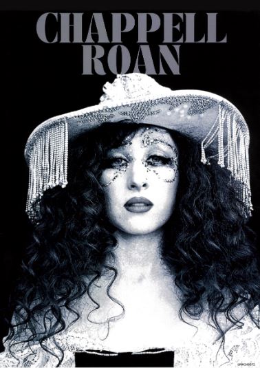 The "Chappell Roan Cowboy Hat Black & White" poster by Blue Dog Posters features a confident figure with curly hair, a decorated fringe hat, and glittery makeup. "CHAPPELL ROAN" is in bold at the top—perfect for A3 satin paper prints.