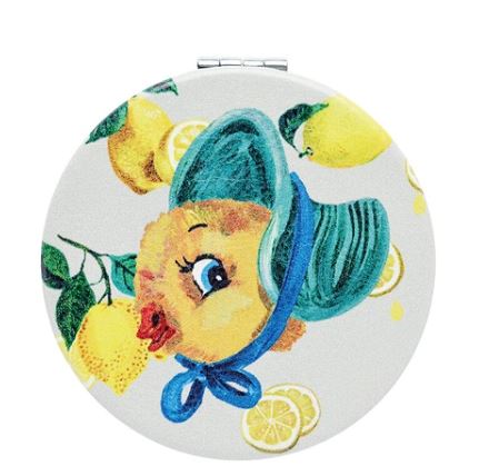 The Round Compact Mirror Chick with Hat by Blue Dog Posters features a chick in a blue hat with lemons on a white background. Imported from Japan.