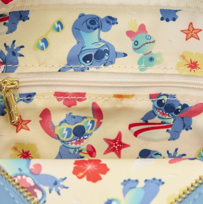 The Lilo & Stitch - Stitch Beach Crossbuddy by Blue Dog Posters features a lively fabric design with cartoon characters surfing, sporting sunglasses, and encircled by starfish and flowers. This Vegan Leather Bag is set against a light yellow backdrop with vibrant red, blue, and turquoise accents and includes a convenient zipper closure at the top.