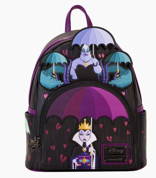 Introducing the Disney Villains Curse Your Hearts Mini Backpack by Blue Dog Posters: a black Loungefly Mini Backpack adorned with Disney villains. The Evil Queen from Snow White holds a purple umbrella on the front pocket, while Ursula from The Little Mermaid is featured above with additional umbrellas. Accented in vibrant purple and boasting a small "Curse Your Hearts" label, this backpack is perfect for fans of Disney Villains.