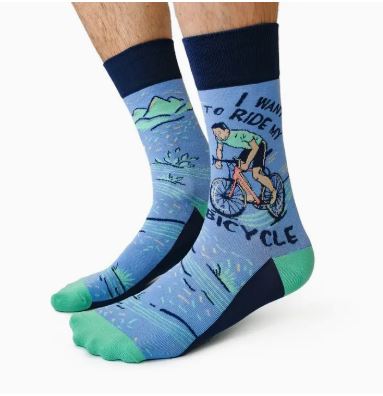 Cycling Spokesman Men Socks by Blue Dog Posters: Fun blue cotton socks with a cartoon cyclist, mountain and water design, “I want to ride my bicycle” print, plus green toes and navy blue heels and cuffs.