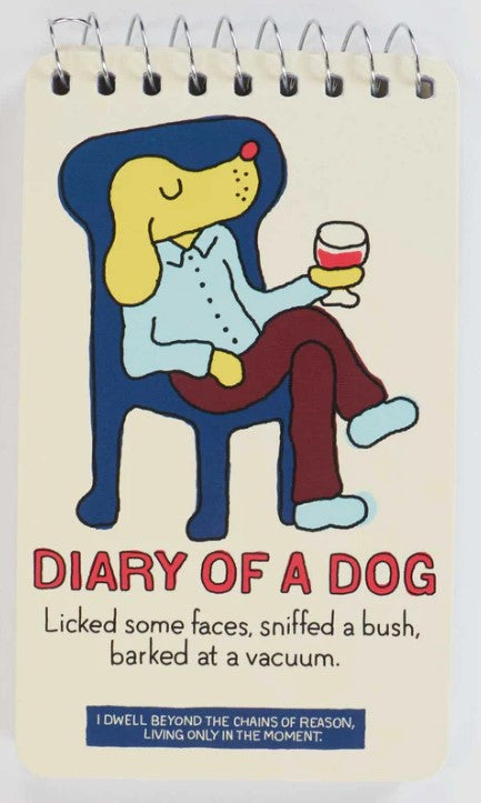 A cartoon dog in a shirt and pants relaxes on a blue chair with a drink. Text: "DIARY OF A DOG: Licked some faces, sniffed a bush, barked at a vacuum, chased a chipmunk." Blue Dog Posters Mini Notebook - Living only in the moment.