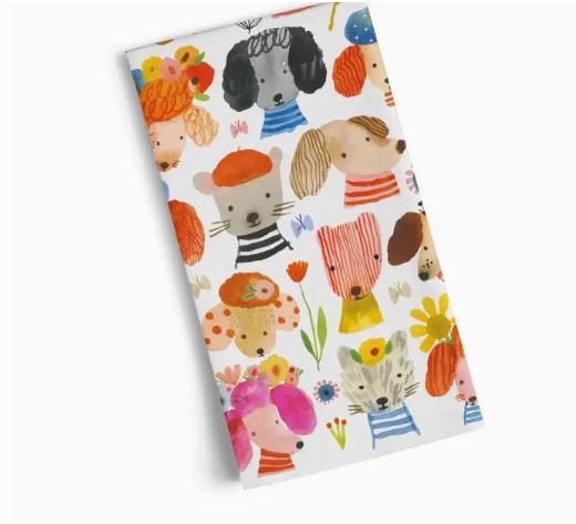 The Werkshoppe Tea Towel Dog Earred by Blue Dog Posters features Carolyn Gavin’s playful animal illustrations—dogs, cats, and mice in striped outfits with flowers—on a crisp white cotton background.
