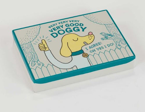 The Blue Dog Posters "Very Very Very Very Good Doggy" Small Tin features a cartoon dog giving a thumbs up with the text "VERY VERY VERY VERY GOOD DOGGY" and "I AGREE! OH YES I DO!", plus trees, birds, and a fence—perfect for dog lovers.
